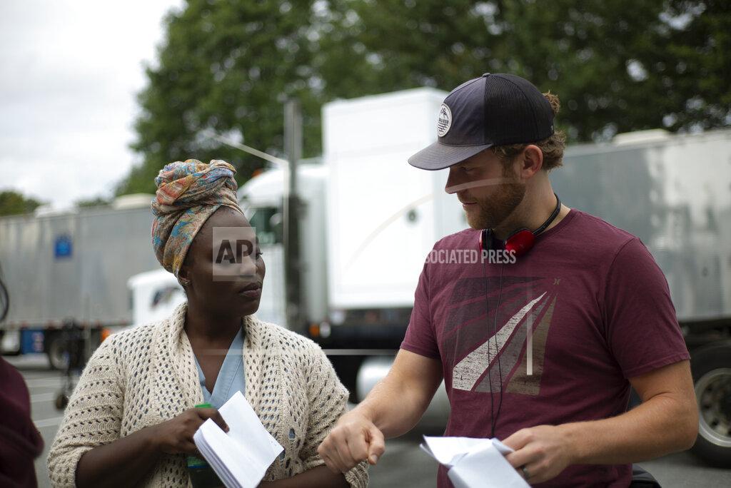 Jessica Kourkounis This image released by Netflix shows Liz Preistley, left, with director Ricky Staub on the set of "Concrete Cowboys." (Jessica Kourkounis/Netflix via AP)