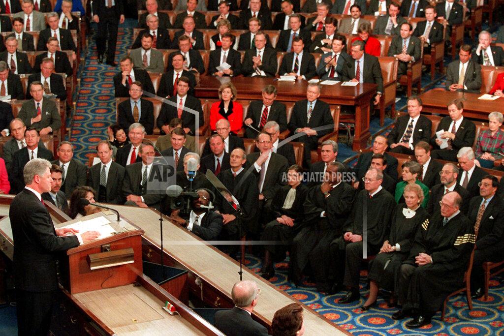 FILE - In this Jan. 23, 1996, file photo, President Bill Clinton gestures while giving his State of the Union address to a joint session of Congress on Capitol Hill, in Washington. When he stood before Congress in 1996 and declared “the era of big government is over,” Clinton gave voice to a doctrine that permeated Democratic politics for more than two decades. Government, while necessary, shouldn't be celebrated if the party wanted to win elections. The coronavirus is changing that. Democrats are enthusiastically embracing the idea of a robust role for government in American life, abandoning concerns they might alienate the relatively narrow slice of independent voters. (AP Photo/Greg Gibson, File)