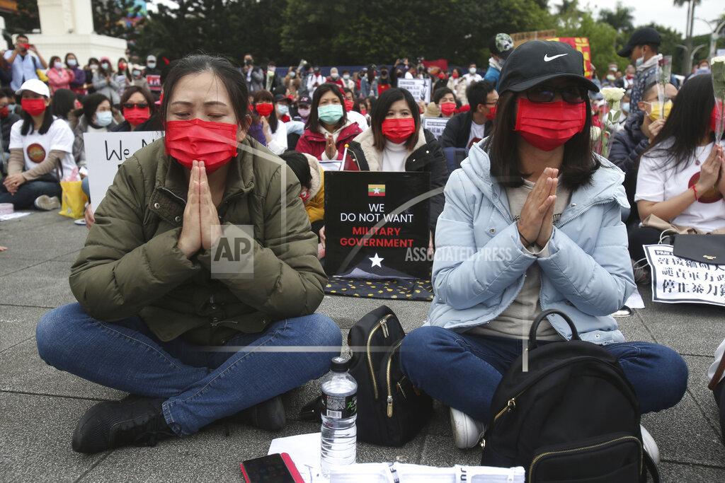 Chiang Ying-Ying Myanmar nationals living in Taiwan pray for victims and express their disdain against the military regime in Myanmar during a demonstration at Liberty Square in Taipei, Taiwan, Sunday, March 21, 2021. (AP Photo/Chiang Ying-ying)