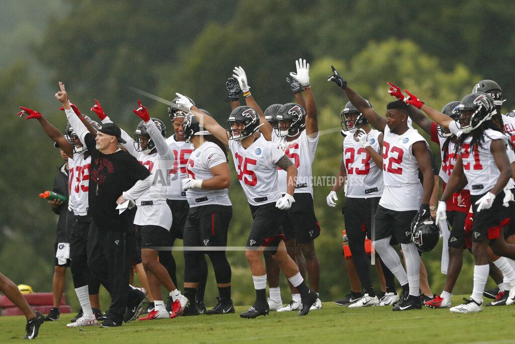 John Bazemore Atlanta Falcons head coach Dan Quinn, left, and the defense react on the sideline during their NFL training camp football practice Tuesday, July 23, 2019, in Flowery Branch, Ga.(AP Photo/John Bazemore)