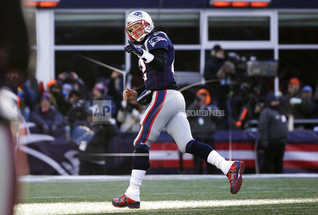 Elise Amendola New England Patriots quarterback Tom Brady celebrates his touchdown pass to Phillip Dorsett during the first half of an NFL divisional playoff football game against the Los Angeles Chargers, Sunday, Jan. 13, 2019, in Foxborough, Mass. (AP Photo/Elise Amendola)