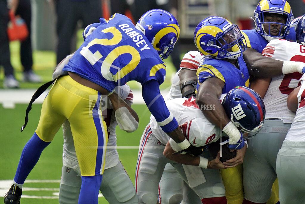 Jae C. Hong New York Giants quarterback Daniel Jones, center, is sacked by Los Angeles Rams cornerback Jalen Ramsey (20) during the first half of an NFL football game Sunday, Oct. 4, 2020, in Inglewood, Calif. (AP Photo/Jae C. Hong )