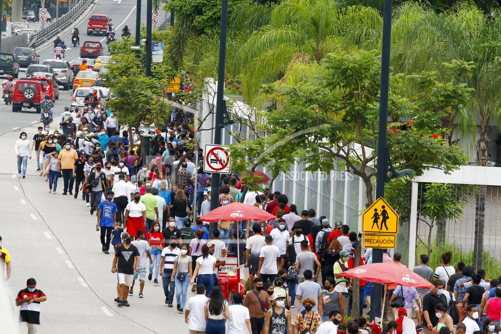 Angel Dejesus Voters line up at the Instituto Tecnológico Superior Simón Bolívar during general elections in Guayaquil, Ecuador, Sunday, Feb. 7, 2021. Amidst the new coronavirus pandemic Ecuadoreans went to the polls in a first round presidential and legislative election. (AP Photo/Angel Dejesus)