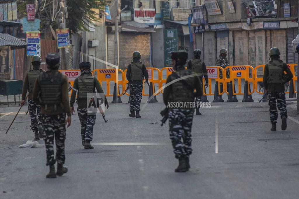 Dar Yasin Paramilitary soldiers patrol a deserted street on the first anniversary of India’s decision to revoke the disputed region’s semi-autonomy, in Srinagar, Indian controlled Kashmir, Wednesday, Aug. 5, 2020. Last year on Aug. 5, India’s Hindu-nationalist-led government of Prime Minister Narendra Modi stripped Jammu-Kashmir of its statehood and divided it into two federally governed territories. Late Tuesday, authorities lifted a curfew in Srinagar but said restrictions on public movement, transport and commercial activities would continue because of the coronavirus pandemic. (AP Photo/ Dar Yasin)