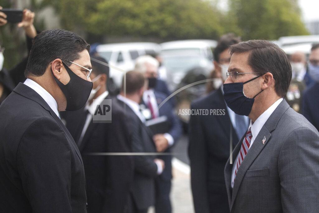 Mosa'ab Elshamy U.S Secretary of Defense Mark Esper, right, is received by Moroccan Foreign Minister Nasser Bourita, left, in Rabat, Morocco, Friday, Oct. 2, 2020. The visit is part of U.S. Defense Secretary Mark Esper's North Africa tour and is his first visit to Africa as defense secretary. (AP Photo/Mosa'ab Elshamy)