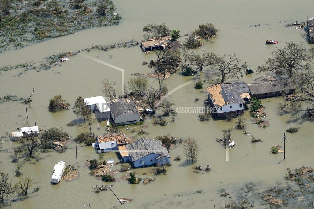 David J. Phillip Buildings and homes are flooded in the aftermath of Hurricane Laura Thursday, Aug. 27, 2020, near Lake Charles, La. (AP Photo/David J. Phillip)