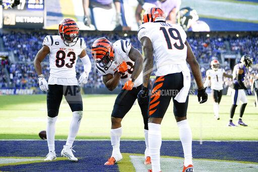 Cincinnati Bengals running back Joe Mixon, center, celebrates his touchdown run with wide receiver Tyler Boyd (83) and wide receiver Auden Tate (19) during the second half of an NFL football game against the Baltimore Ravens, Sunday, Oct. 24, 2021, in Baltimore. (AP Photo/Nick Wass)