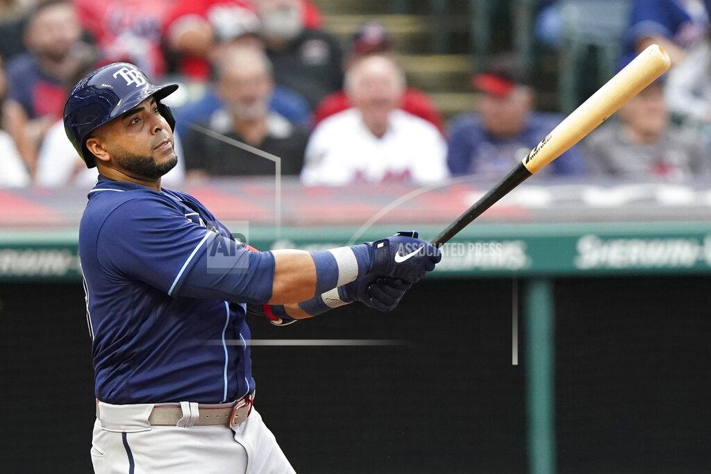 Tony Dejak Tampa Bay Rays' Nelson Cruz watches his solo home run in the third inning of the team's baseball game against the Cleveland Indians, Friday, July 23, 2021, in Cleveland. (AP Photo/Tony Dejak)