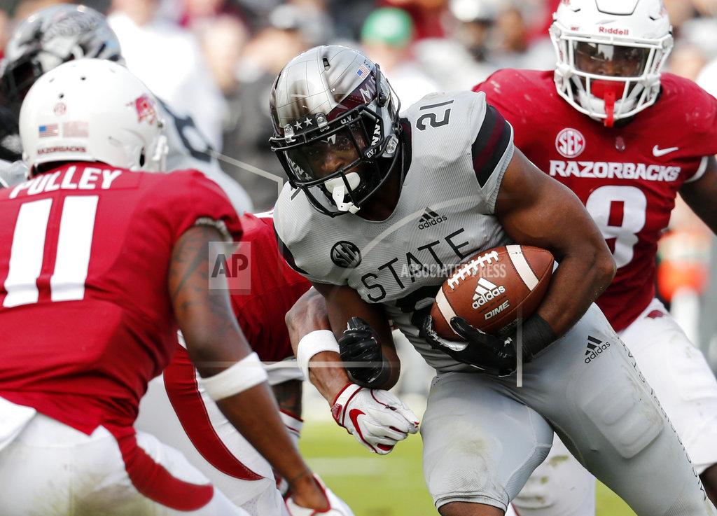 Rogelio V. Solis Mississippi State running back Nick Gibson (21) rushes for a first down against Arkansas during the first half of an NCAA college football game in Starkville, Miss., Saturday, Nov. 17, 2018. (AP Photo/Rogelio V. Solis)