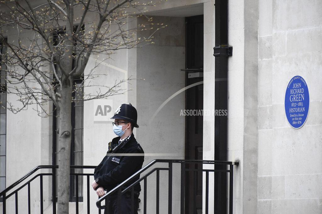 Alberto Pezzali A Police officer stands outside the entrance of King Edward VII hospital where Britain's Prince Philip is receiving treatment in London in London, Monday, March 15, 2021. The 99-year-old husband of Queen Elizabeth II remains hospitalized after a heart procedure. (AP Photo/Alberto Pezzali)