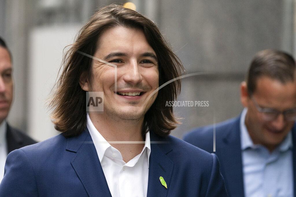 Mark Lennihan Vladimir Tenev, CEO and Co-Founder of Robinhood, walks in New York's Times Square following his company's IPO, Thursday, July 29, 2021. Robinhood is selling its own stock on Wall Street, the very place the online brokerage has rattled with its stated goal of democratizing finance. Through its app, Robinhood has introduced millions to investing and reshaped the brokerage industry, all while racking up a long list of controversies in less than eight years. (AP Photo/Mark Lennihan)
