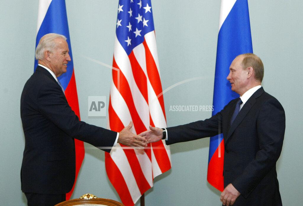 Alexander Zemlianichenko FILE - In this March 10, 2011, file photo, Vice President of the United States Joe Biden, left, shakes hands with Russian Prime Minister Vladimir Putin in Moscow, Russia. The Kremlin said Friday March 19, 2021, that President Vladimir Putin's offer for a quick call with U.S. President Joe Biden was intended to prevent bilateral ties from completely falling apart over Biden's description of the Russian leader as a killer. (AP Photo/Alexander Zemlianichenko, File)