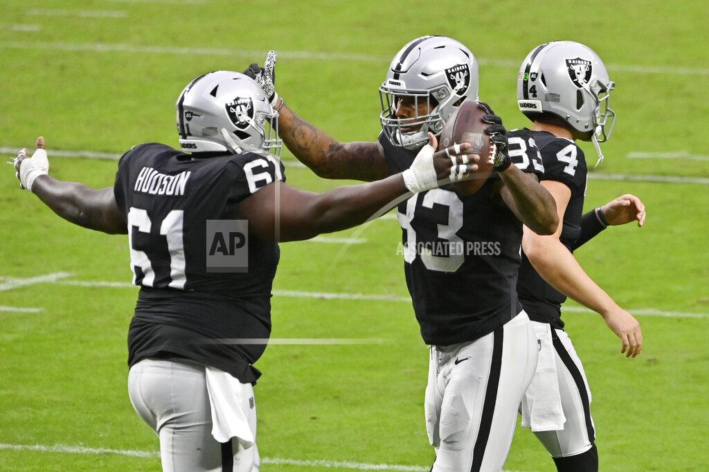 David Becker Las Vegas Raiders center Rodney Hudson (61) celebrates with tight end Darren Waller (83) after Waller scored a touchdown against the Tampa Bay Buccaneers during the second half of an NFL football game, Sunday, Oct. 25, 2020, in Las Vegas. (AP Photo/David Becker)