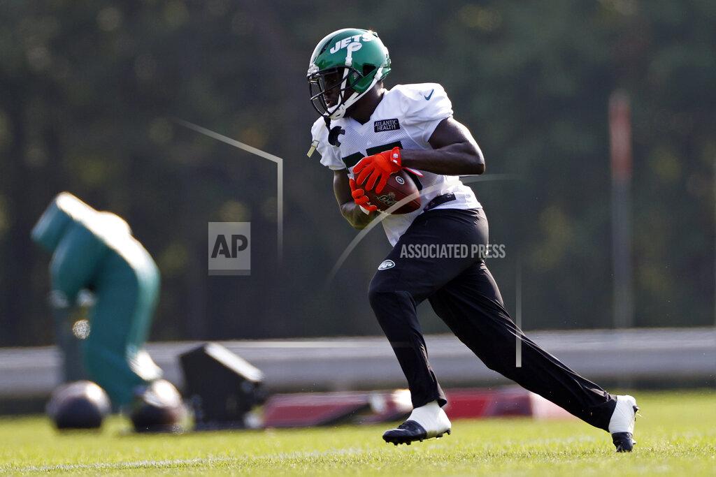 FILE - In this Aug. 25, 2020, file photo, New York Jets running back Frank Gore runs with the ball during a practice at the NFL football team's training camp in Florham Park, N.J. Gore took his first NFL snaps as a pro with the San Francisco 49ers in 2005 in what seems like a lifetime ago for the NFL’s third-leading rusher. It all comes full circle for the 37-year-old Gore on Sunday, Sept. 20, 2020, when his Jets host the team with which he began his career 16 years ago. (AP Photo/Adam Hunger, File)