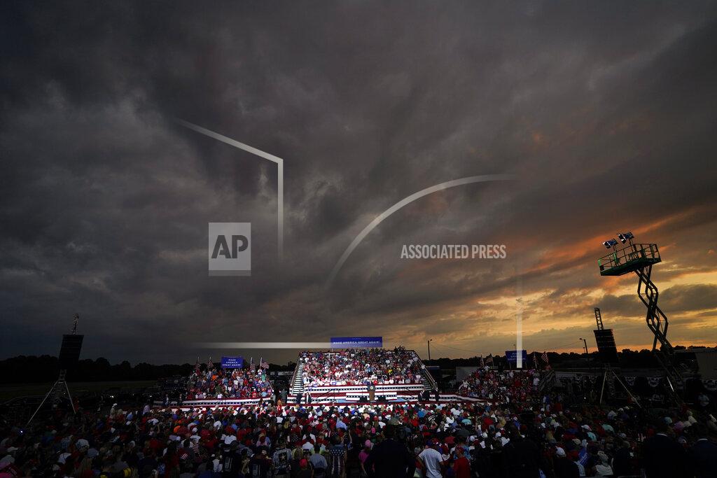 FILE - In this Sept. 8, 2020, file photo President Donald Trump speaks at a campaign rally in Winston-Salem, N.C. The evolving portrait of suburban life in one of the nation's most consequential swing states suggests that Trump's push to inject new dynamics into the final weeks of the 2020 election is being overshadowed by the frightening realities of everyday life in the pandemic. (AP Photo/Chris Carlson, File)