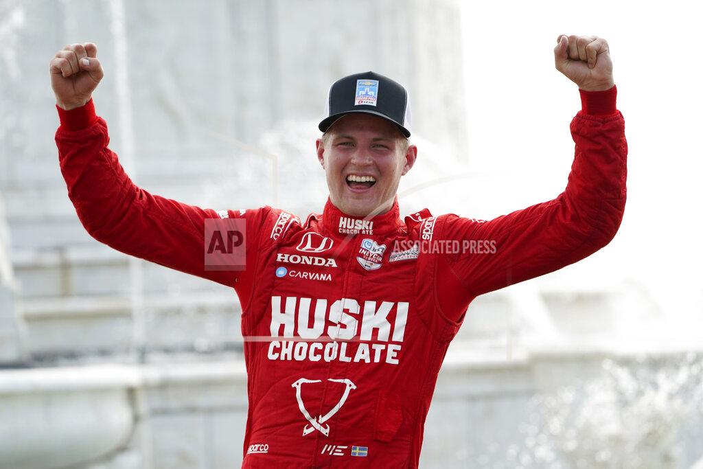 Paul Sancya Marcus Ericsson, of Sweden, celebrates winning the first race of the IndyCar Detroit Grand Prix auto racing doubleheader on Belle Isle in Detroit, Saturday, June 12, 2021. (AP Photo/Paul Sancya)