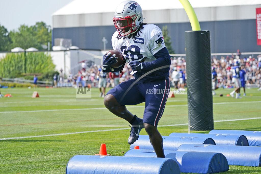 Steven Senne New England Patriots running back Rhamondre Stevenson runs a drill during a joint NFL football practice with the New York Giants, Wednesday, Aug. 25, 2021, in Foxborough, Mass. (AP Photo/Steven Senne)