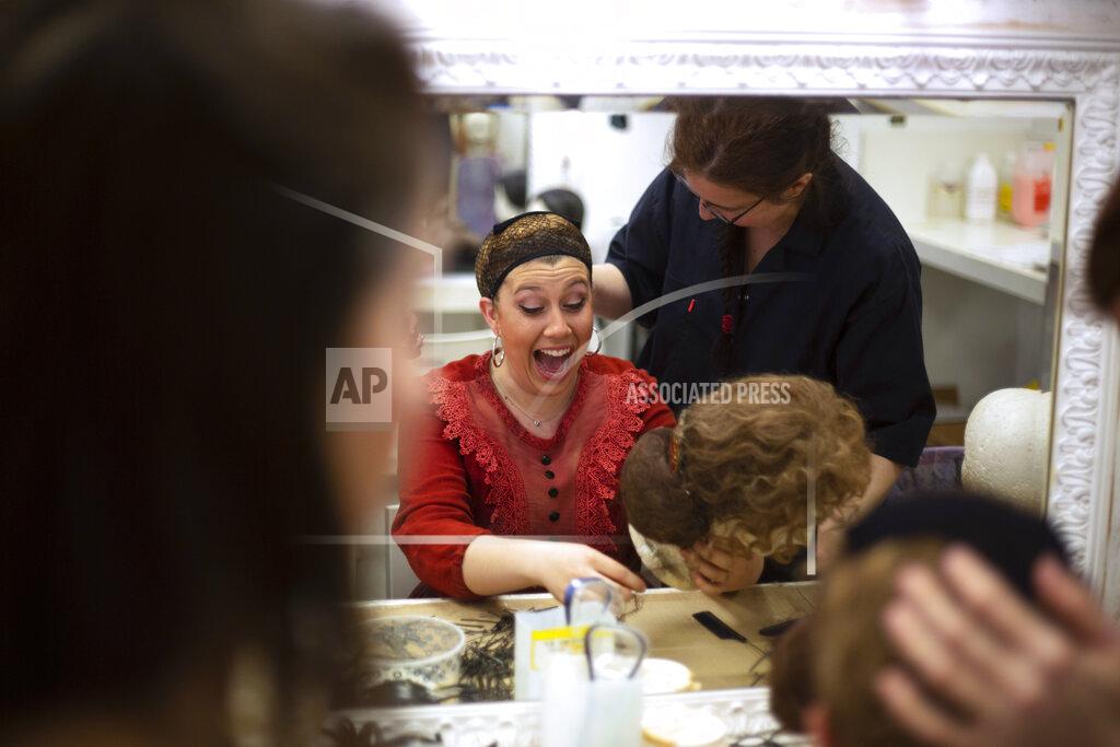 Ariel Schalit Israeli actor Shiran Huberman gets ready in the backstage dressing room before a show for vaccinated spectators at HaBima, Israel's national theater, in Tel Aviv, Israel, Sunday, April 4, 2021. Israel has vaccinated over half its population of 9.3 million, and as coronavirus infections have plummeted, authorities have allowed restaurants, hotels, museums and theaters to reopen. (AP Photo/Ariel Schalit)