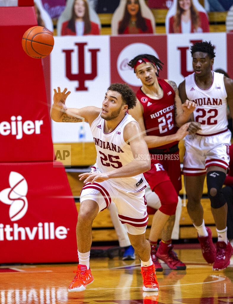 Doug Mcschooler Indiana forward Race Thompson (25) tries to recover a loose ball during the second half of an NCAA college basketball game against Rutgers, Sunday, Jan. 24, 2021, in Bloomington, Ind. (AP Photo/Doug McSchooler)