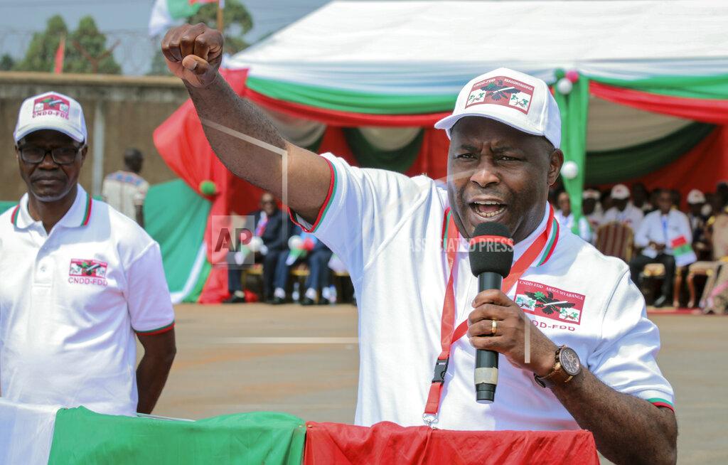 FILE - In this Sunday, Jan. 26, 2020 file photo, Burundi Army Gen. Evariste Ndayishimiye gestures to party supporters after being chosen as their presidential candidate, at a national conference for the ruling CNDD-FDD party in the rural province of Gitega, Burundi. A new report released Thursday, Sept. 17, 2020, by the United Nations commission of inquiry on Burundi sees little optimism in the government of new President Evariste Ndayishimiye, saying it is "extremely concerned" that he has appointed senior officials who face international sanctions for alleged human rights abuses in the country's 2015 political turmoil. (AP Photo/Berthier Mugiraneza, File)