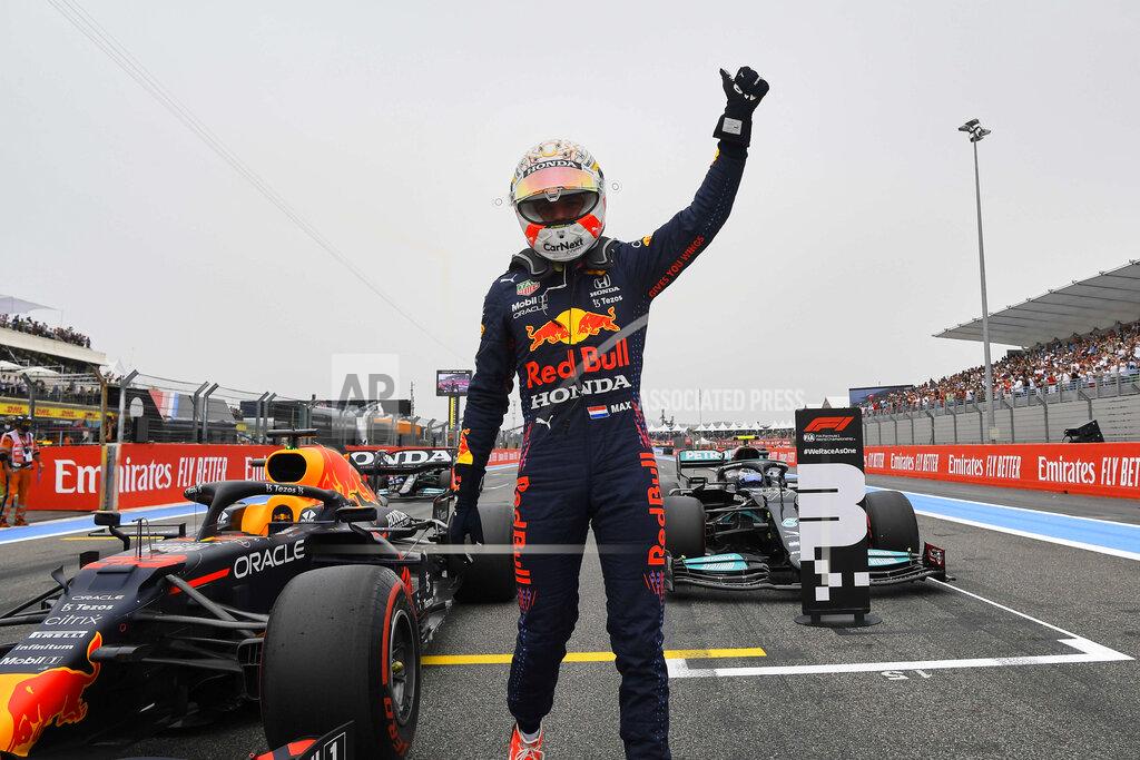 Nicolas Tucat Red Bull driver Max Verstappen of the Netherlands waves to the crowd after he clocked the fastest time during the qualifying session ahead of the French Formula One Grand Prix at the Paul Ricard racetrack in Le Castellet, southern France, Saturday, June 19, 2021. The French Grand Prix will be held on Sunday. (Nicolas Tucat/Pool via AP)