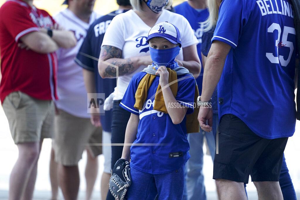 Eric Gay Fans arrive before Game 1 of a baseball National League Championship Series between the Los Angeles Dodgers and the Atlanta Braves Monday, Oct. 12, 2020, in Arlington, Texas. (AP Photo/Eric Gay)