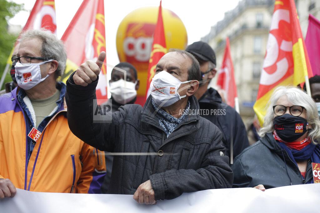 Thibault Camus GGT leftist union leader Philippe Martinez gestures during May Day demonstration, Saturday, May 1, 2021 in Paris. Workers and union leaders dusted off bullhorns and flags that had stayed furled during coronavirus lockdowns for slimmed down but still boisterous May Day marches on Saturday, demanding more labor protections amid a pandemic that has turned economies and workplaces upside down. (AP Photo/Thibault Camus)
