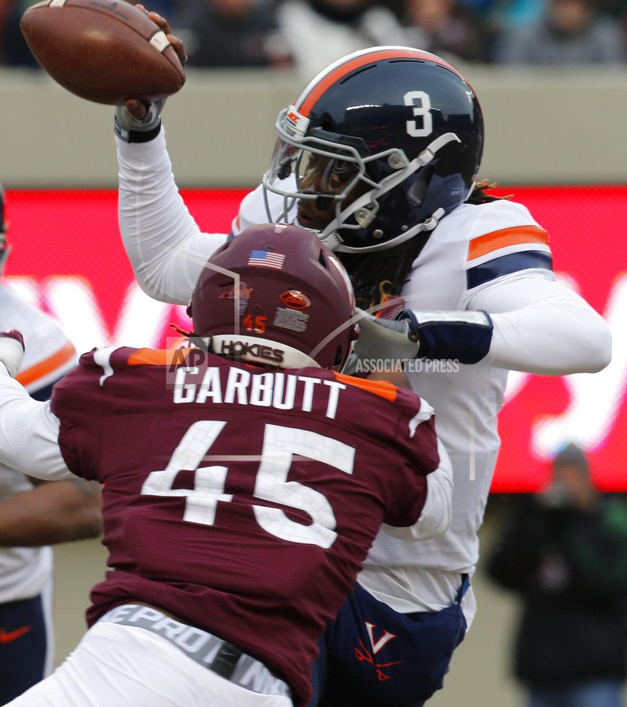 Steve Helber Virginia linebacker Reed Kellam, (45), grabs the hair of Virginia quarterback Bryce Perkins (3) as he sacks him during the first half of an NCAA college football game in Blacksburg, Va., Friday, Nov. 23, 2018. (AP Photo/Steve Helber)