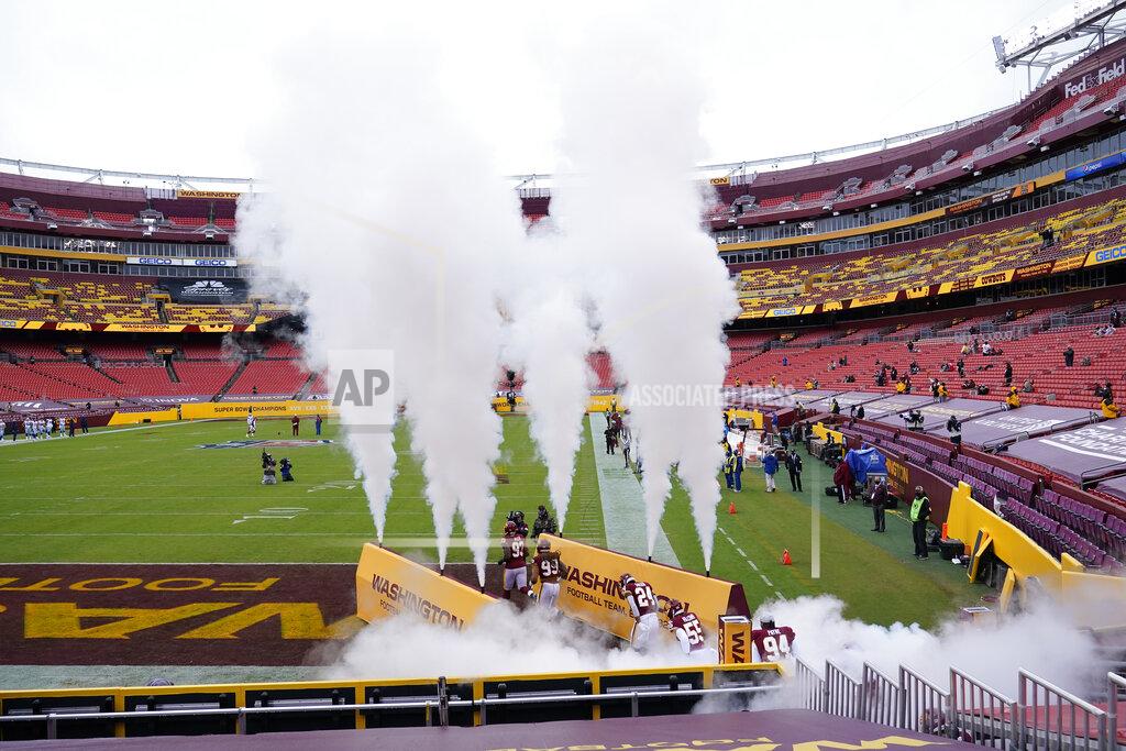 Susan Walsh Members of the Washington Football Team take the field before the start of the first half of an NFL football game against Dallas Cowboys, Sunday, Oct. 25, 2020, in Landover, Md. (AP Photo/Susan Walsh)