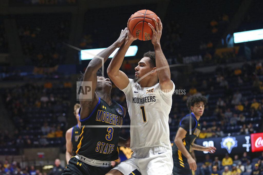 Kathleen Batten West Virginia forward Emmitt Matthews Jr. (1) is defended by Morehead State guard Drew Thelwell (3) during the second half of an NCAA college basketball game in Morgantown, W.Va., Tuesday, Nov. 15, 2022. (AP Photo/Kathleen Batten)