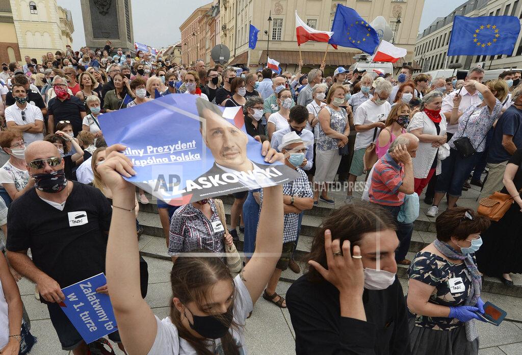 Czarek Sokolowski Supporters attend a rally of a candidate in Poland's presidential election, Warsaw centrist Mayor Rafal Trzaskowski on the last day of campaigning before Sunday's vote, in Castle Square in Warsaw, Poland, on Friday, June 26, 2020. Trzaskowski is a major challenger to incumbent conservative President Andrzej Duda who is seeking a second five-year term and is leading in the polls. (AP Photo/Czarek Sokolowski)