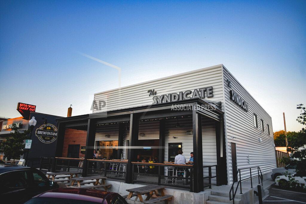 Susie Jarvis This photo provided by Adam M. Rammel shows The Syndicate on Aug. 20, 2020 in Bellefontaine, Ohio. Ohio’s restrictions forced Adam Rammel to at least temporarily abandon plans for a catering and event space designed for parties and that opened last month, in time for the holidays. Rather than have the space sit unused, Rammel turned it into The Syndicate, a restaurant located next door to his 5-year-old brewpub, Brewfontaine. (Susie Jarvis/Adam M. Rammel via AP)