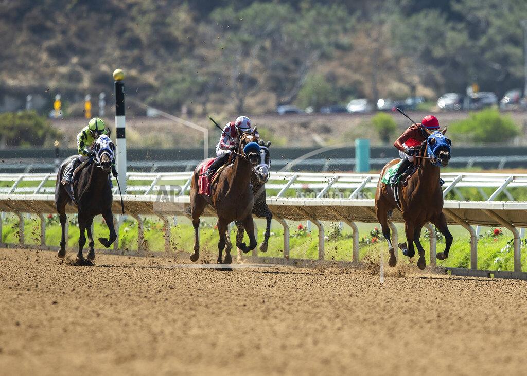Uncredited In this image provided by Benoit Photo, Big Sweep, right, with Flavien Prat aboard, wins the $125,000 Fleet Treat Stakes horse race Friday, July 24, 2020, at Del Mar Thoroughbred Club in Del Mar, Calif. (Benoit Photo via AP)