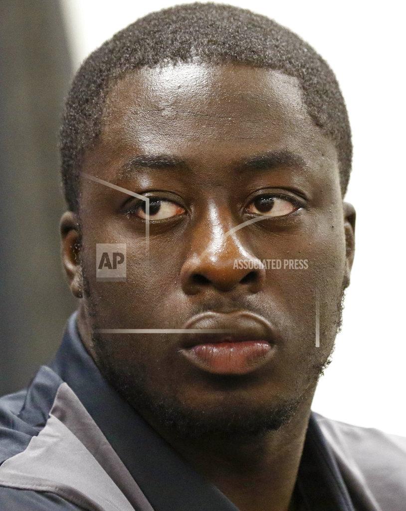 Temple's defensive tackle Michael Dogbe listens to interim football coach Ed Foley, unseen, respond to reporters' questions during the 2018 Independence Bowl news conference in Shreveport, La., Wednesday, Dec. 26, 2018. Temple faces Duke in the NCAA college football game Thursday. (Rogelio V. Solis/AP)