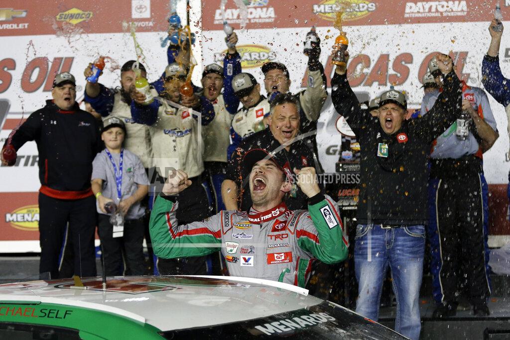 Terry Renna Michael Self, center, celebrates with crew members in Victory Lane after winning the ARCA auto race at Daytona International Speedway, Saturday, Feb. 8, 2020, in Daytona Beach, Fla. (AP Photo/Terry Renna)