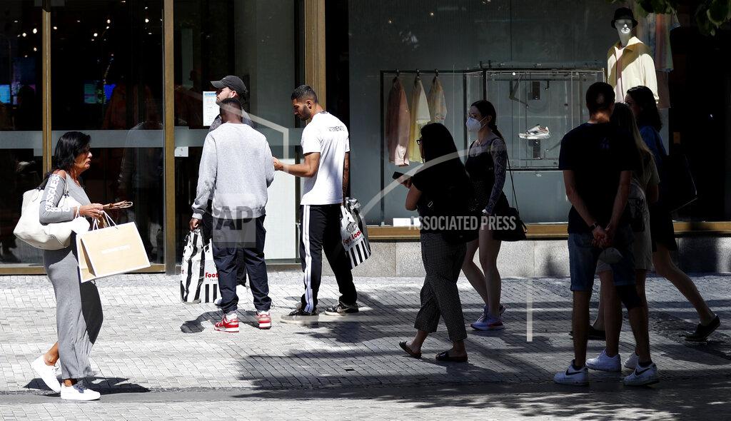 Petr David Josek People wait in line in front of a shop in Prague, Czech Republic, Monday, May 10, 2021. The Czech Republic is massively relaxing its coronavirus restrictions as the hard-hit nation pay respect to nearly 30,000 dead. Monday's wave of easing came after the new infections fell to the levels unseen from August when the government failed to react in time to an opposite trend, the growing numbers of infected which later contributed to record numbers of deaths. (AP Photo/Petr David Josek)