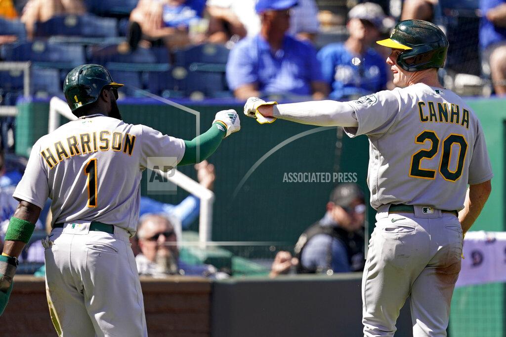 Charlie Riedel Oakland Athletics' Josh Harrison (1) and Mark Canha (20) celebrate after scoring on a single by Chad Pinder during the third inning of a baseball game against the Kansas City Royals Thursday, Sept. 16, 2021, in Kansas City, Mo. (AP Photo/Charlie Riedel)