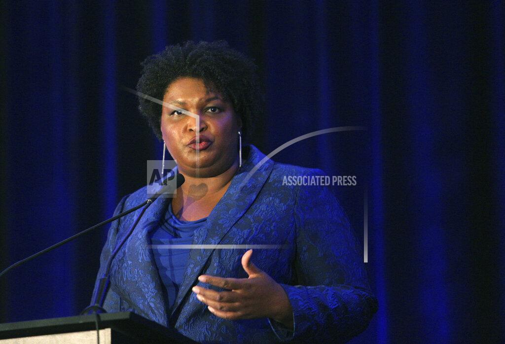 Akili-Casundria Ramsess Stacey Abrams addresses the Gwinnett County Democratic Party fundraiser on Saturday, May 21, 2022, in Norcross, Ga. (AP Photo/Akili-Casundria Ramsess)