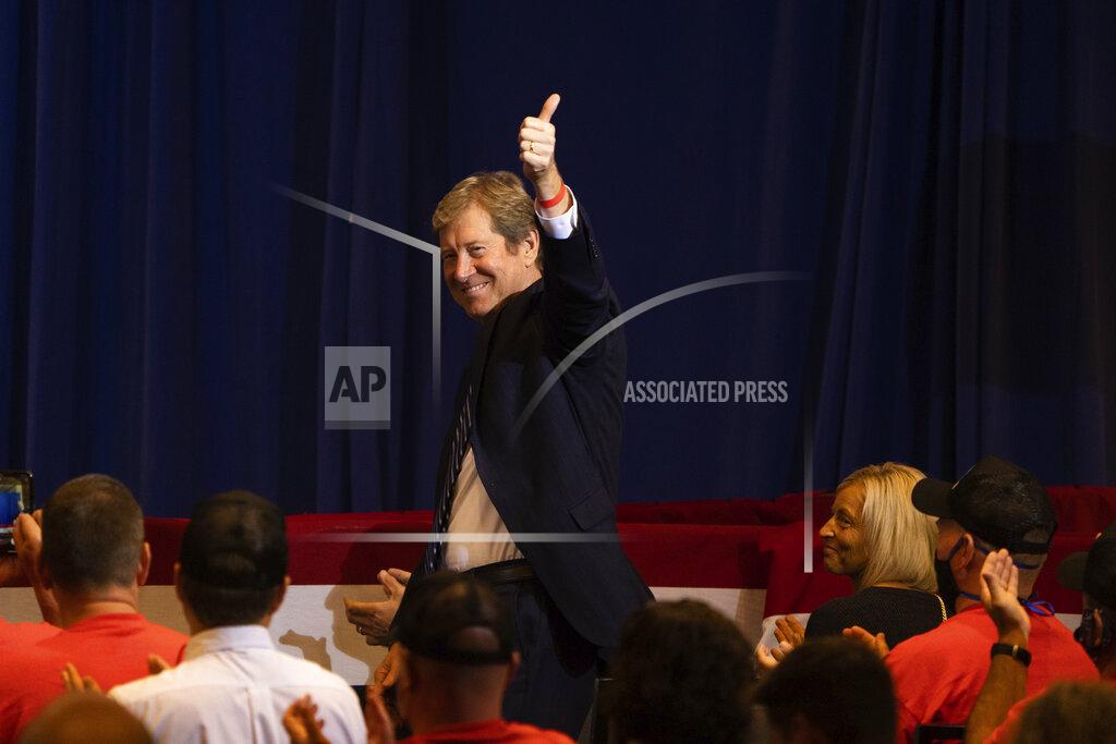 Minnesota candidate for U.S. Senate Jason Lewis stands after being recognized by Vice President Mike Pence at Minneapolis- St. Paul International Airport on Thursday, Sept. 24, 2020.(Evan Frost/Minnesota Public Radio via AP)