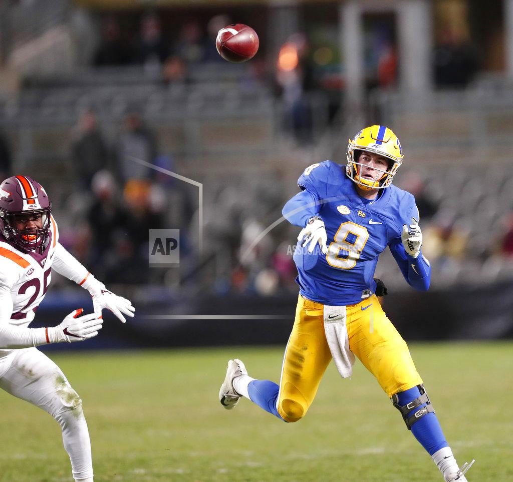 Keith Srakocic Pittsburgh quarterback Kenny Pickett (8) gets a pass off as Virginia Tech defensive back Divine Deablo (25) pursues in the fourth quarter of an NCAA football game, Saturday, Nov. 10, 2018, in Pittsburgh. Pittsburgh won 52-22.(AP Photo/Keith Srakocic)