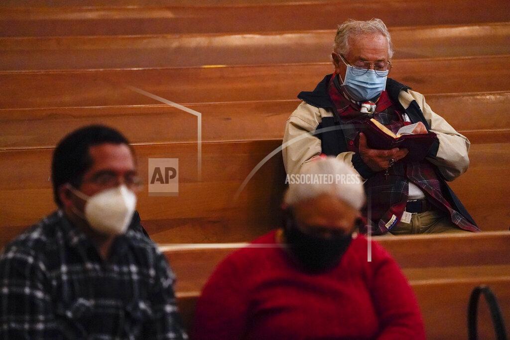 Ashley Landis Worshipers gather for a Christmas Eve Mass inside the Cathedral of Our Lady of the Angels, Thursday, Dec 24, 2020, in Los Angeles. California became the first state to record 2 million confirmed coronavirus cases, reaching the milestone on Christmas Eve as nearly the entire state was under a strict stay-at-home order and hospitals were flooded with the largest crush of cases since the pandemic began. (AP Photo/Ashley Landis)