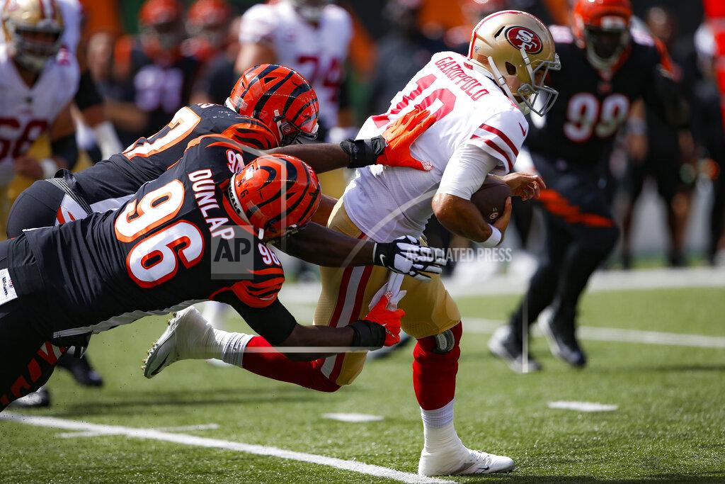 Gary Landers San Francisco 49ers quarterback Jimmy Garoppolo (10) runs the ball against Cincinnati Bengals defensive end Carlos Dunlap (96) during the first half an NFL football game, Sunday, Sept. 15, 2019, in Cincinnati. (AP Photo/Gary Landers)