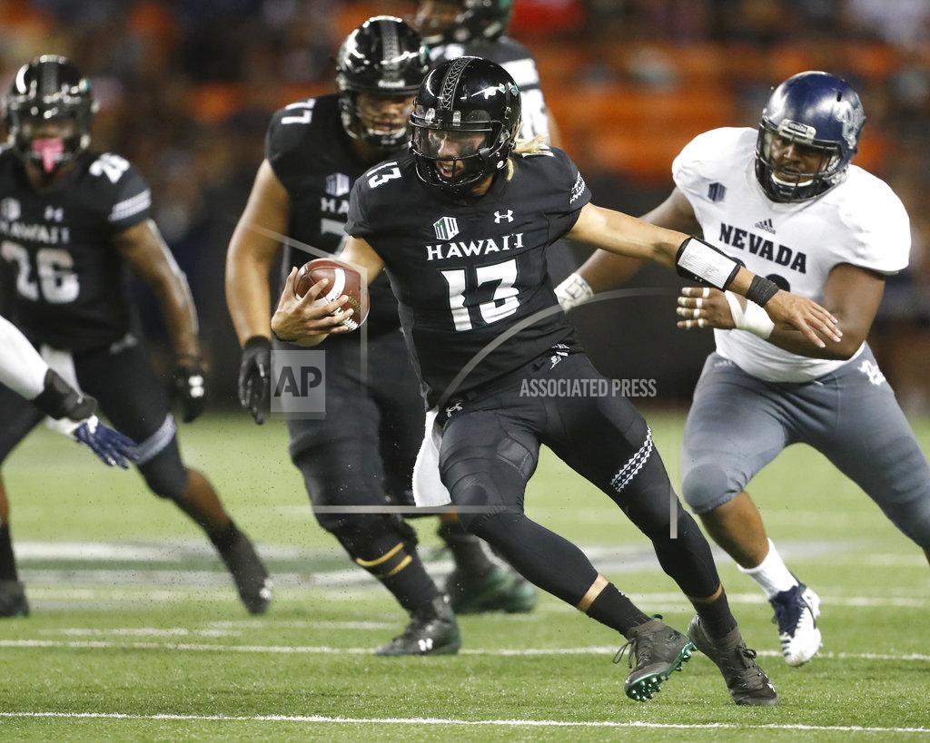 Marco Garcia Hawaii quarterback Cole McDonald (13) runs against Nevada during the fourth quarter at an NCAA college football game Saturday, Oct. 20, 2018, in Honolulu. Nevada defeated Hawaii 40-22. (AP Photo/Marco Garcia)