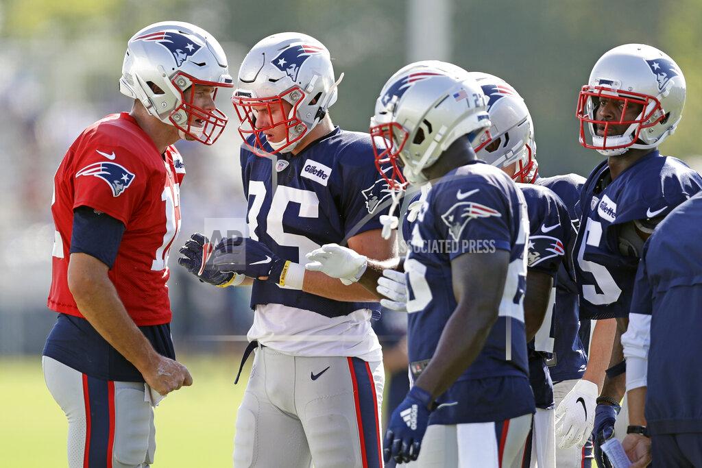 Mark Humphrey New England Patriots quarterback Tom Brady (12), left, calls a play during a combined NFL football training camp with the Tennessee Titans Thursday, Aug. 15, 2019, in Nashville, Tenn. (AP Photo/Mark Humphrey)
