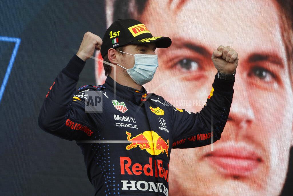 Luca Bruno Red Bull driver Max Verstappen of the Netherlands celebrates on podium after winning the Emilia Romagna Formula One Grand Prix, at the Imola racetrack, Italy, Sunday, April 18, 2021. (AP Photo/Luca Bruno)