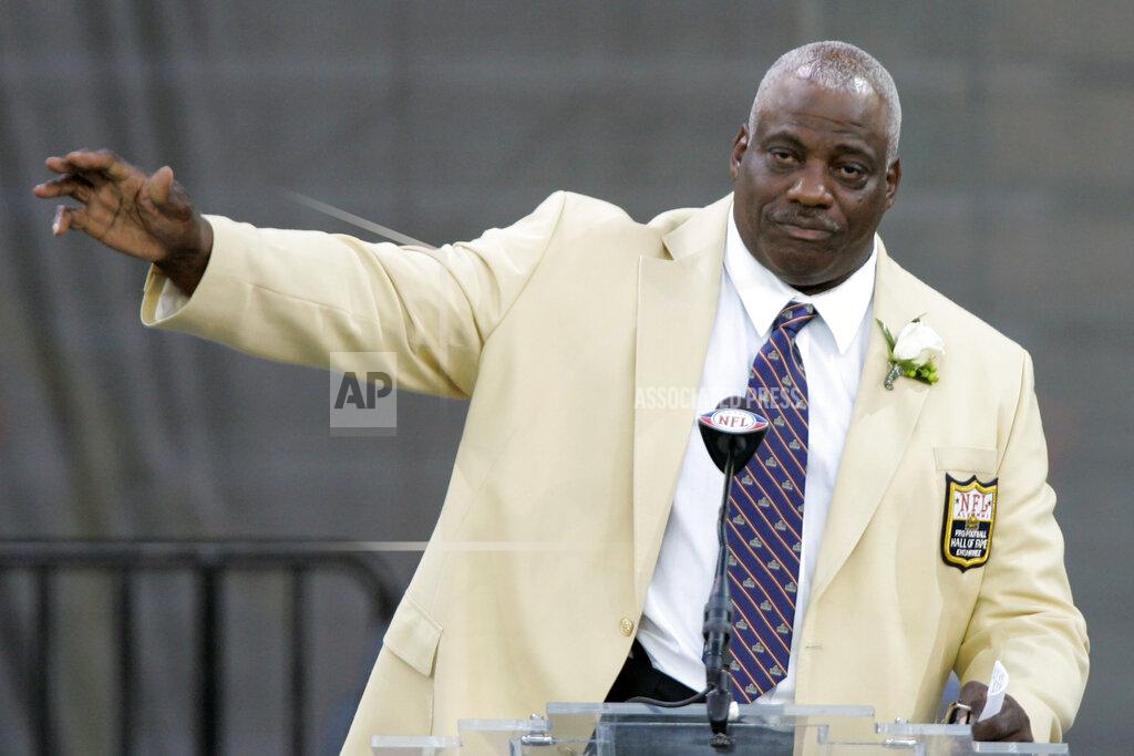 FILE - In this Saturday, Aug. 2, 2008, file photo, former San Diego Chargers defensive end Fred Dean waves to fans after his speech at the Pro Football Hall of Fame, in Canton, Ohio. Dean, the fearsome pass rusher who was a key part of the launch of the San Francisco 49ers' dynasty, has died. He was 68. His death on Wednesday night, Oct. 14, 2020, was confirmed Thursday by the Pro Football Hall of Fame in Canton, Ohio. (AP Photo/Mark Duncan, File)