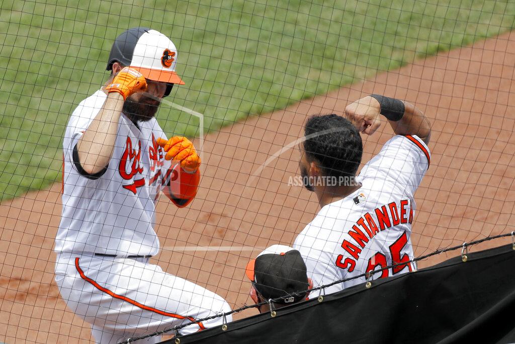 Julio Cortez Baltimore Orioles' Renato Nunez, left, is greeted near the dugout by Anthony Santander after hitting a solo home run off Tampa Bay Rays relief pitcher Yonny Chirinos during the third inning of a baseball game, Sun, Aug. 2, 2020, in Baltimore. (AP Photo/Julio Cortez)