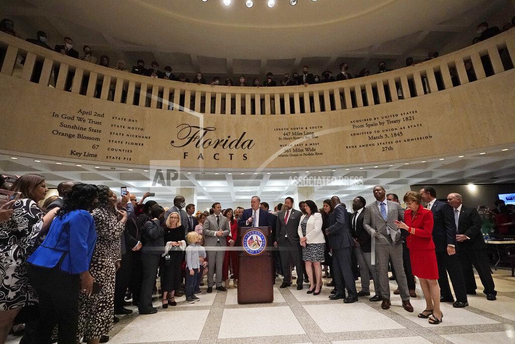 Wilfredo Lee Surrounded by lawmakers, Florida Senate President Wilton Simpson speaks to members of the media after the end of a legislative session, Friday, April 30, 2021, at the Capitol in Tallahassee, Fla. (AP Photo/Wilfredo Lee)