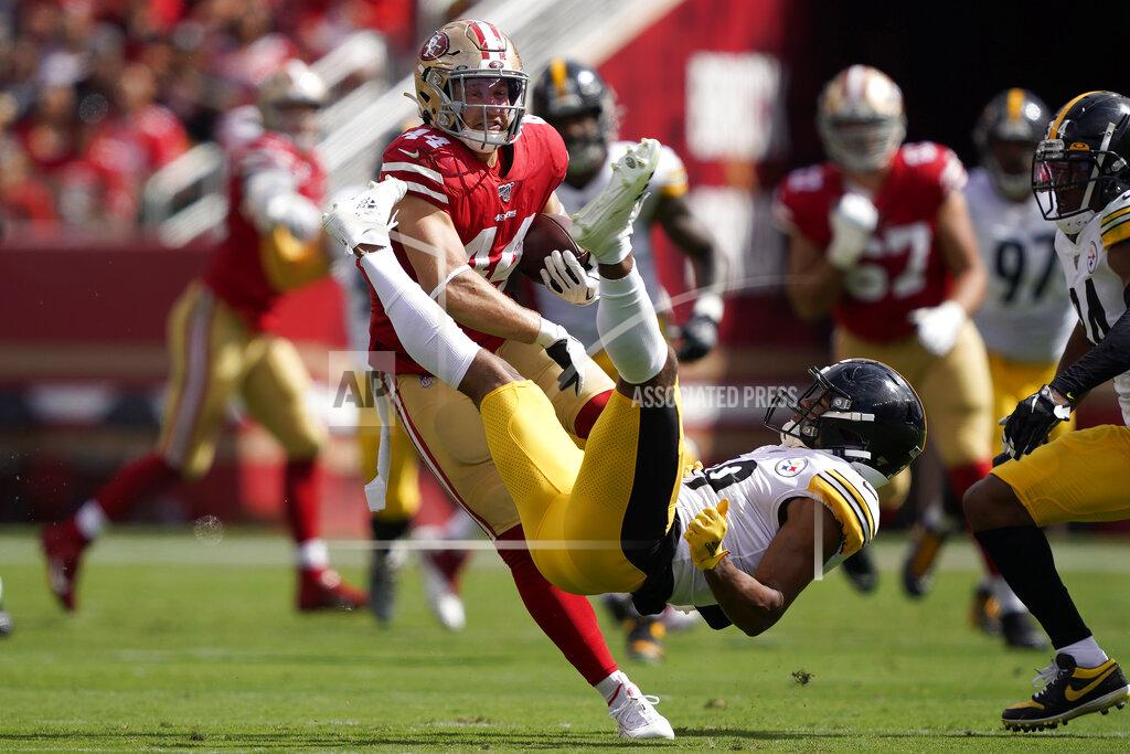 Tony Avelar San Francisco 49ers fullback Kyle Juszczyk, left, breaks a tackle attempt by Pittsburgh Steelers free safety Minkah Fitzpatrick during the first half of an NFL football game in Santa Clara, Calif., Sunday, Sept. 22, 2019. (AP Photo/Tony Avelar)