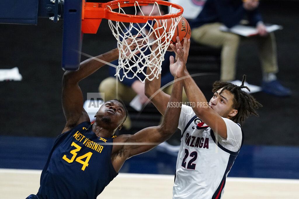 Darron Cummings West Virginia's Oscar Tshiebwe (34) and Gonzaga's Anton Watson (22) vie for a rebound during the first half of an NCAA college basketball game Wednesday, Dec. 2, 2020, in Indianapolis. (AP Photo/Darron Cummings)